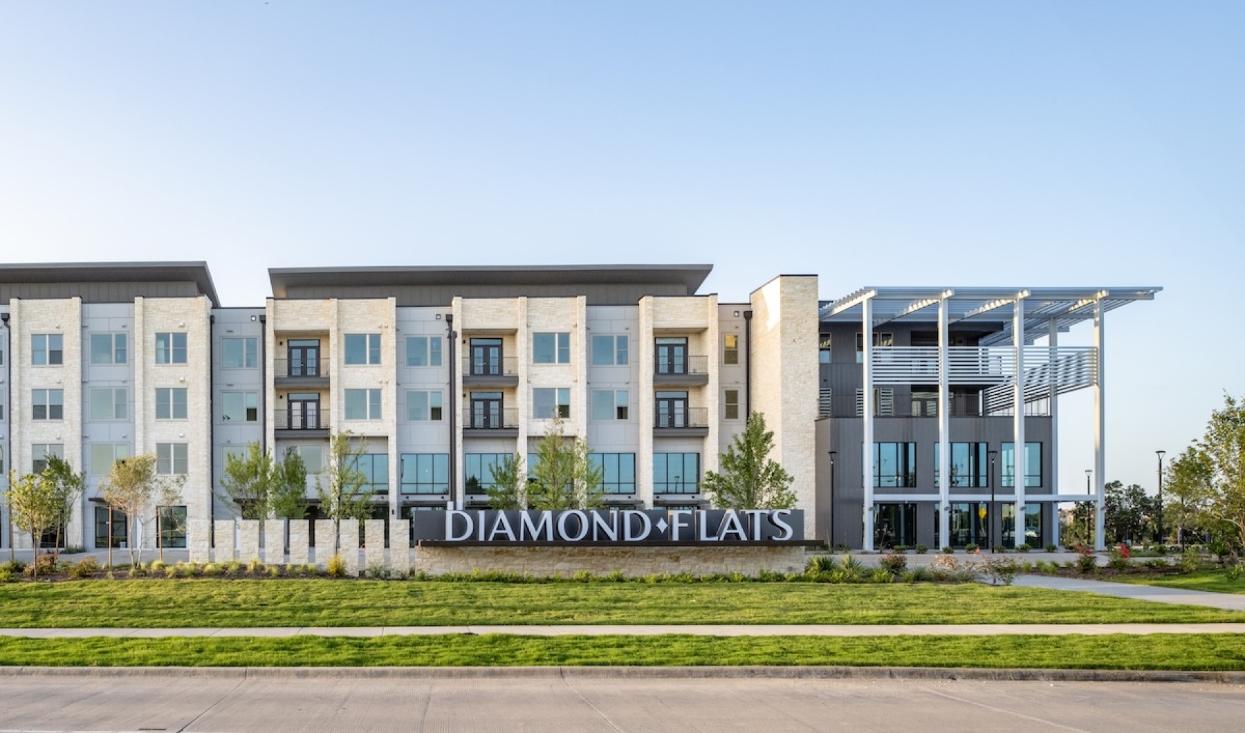 Find your perfect fit at Diamond Flats exterior of a building  with a sign in front that reads diamond flats