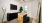 a room with a desk and ample light