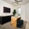 a room with a desk and ample light