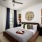 bedroom with a bed and sidetable and window